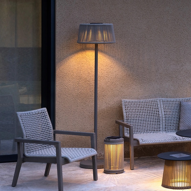 Woven floor lamp next to the outdoor bench