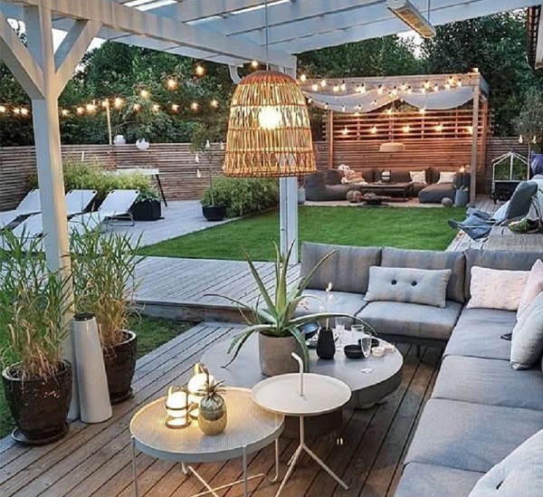 A combination of various lighting fixtures creates a stylish terrace design.
