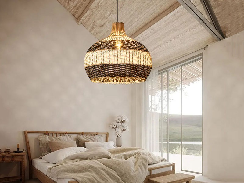 A close-weave rattan pendant lamp with a 2700K color temperature illuminates the bedroom.