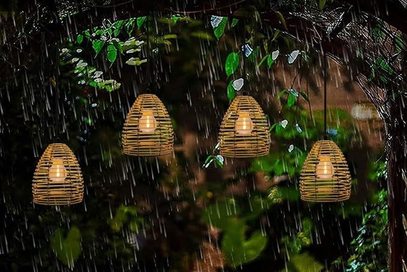 Close-up of a synthetic rattan lamp with water droplets